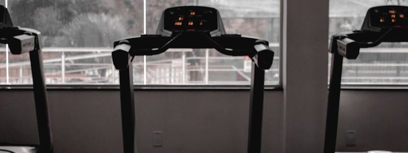 Modern industrial gym space with professional equipment.